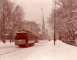 Image of: "Woodward Avenue in Winter Attire," Streetcar and Pedestrians, Detroit, Michigan